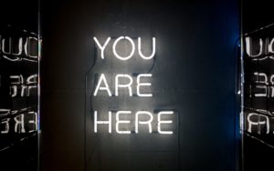 You are here white neon sign